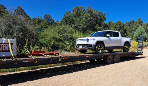 Repaired Rivian coming home on flatbed truck.